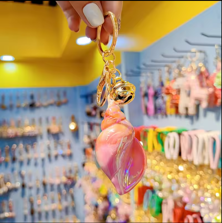 Porte-clés conque en résine arc-en-ciel