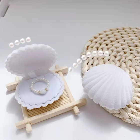 Boîte à bijoux en velours en forme de coquillage